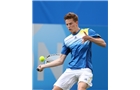 EASTBOURNE, ENGLAND - JUNE 14: Scott Clayton of Great Britain plays a forehand against Chris Guccione of Australia during their Men's Singles qualifying match on day one of the Aegon International at Devonshire Park on June 14, 2014 in Eastbourne, England.  (Photo by Steve Bardens/Getty Images)